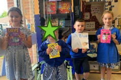 image of four children holding books as part of the reading stars for week 23rd Jul 24